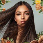 A beautiful woman with long, shiny hair showing how to grow hair faster naturally using homemade remedies.